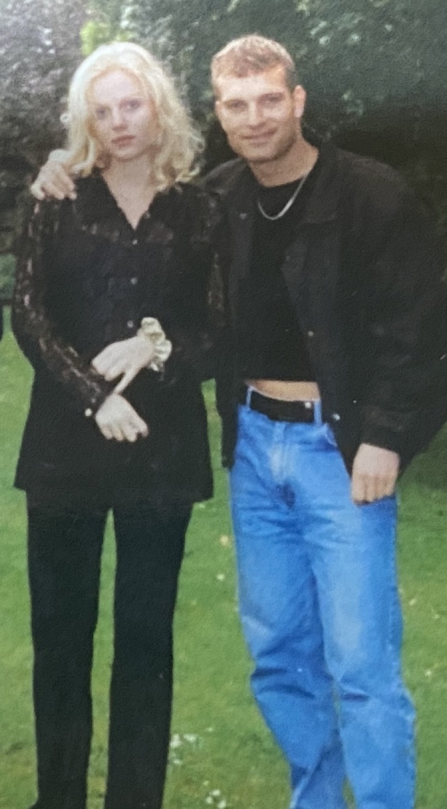 Alysha with the father of her son, in a garden